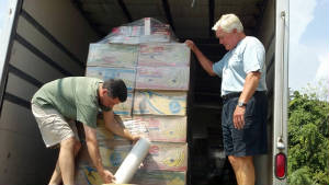 tony_and_ken_wrapping_pallat_for_shipment_to_ch.jpg